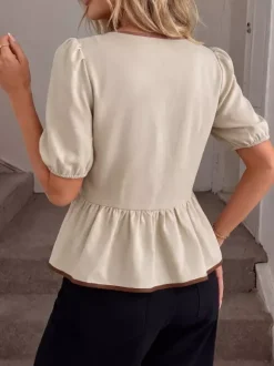 Blouse péplum à col rond et n艙ud contrastant manches bouffantes et manches bouffantes