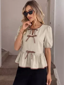 Blouse péplum à col rond et n艙ud contrastant manches bouffantes et manches bouffantes