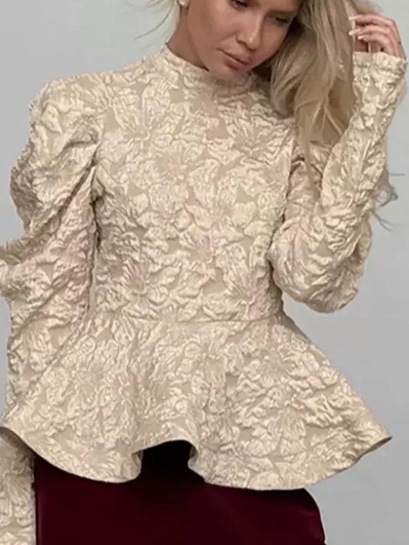 Blouse texturée en jacquard à manches bouffantes col montant taille péplum ourlet évasé