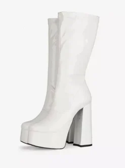 Bottes Gogo jaunes à plateforme et talon compensé en cuir verni brillant.