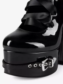 Bottes noires hautes à plateforme et boucle lacets et talons épais