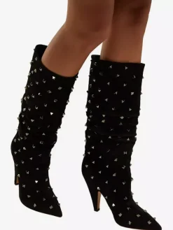 Bottes souples noires en daim à bout pointu et talon épais clouté mi-mollet