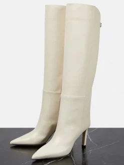 Bottes hautes blanches à bout pointu et talons hauts  bottes larges aux mollets