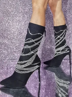 Bottes mi-mollet en daim à bout pointu et talon aiguille avec détail en métal