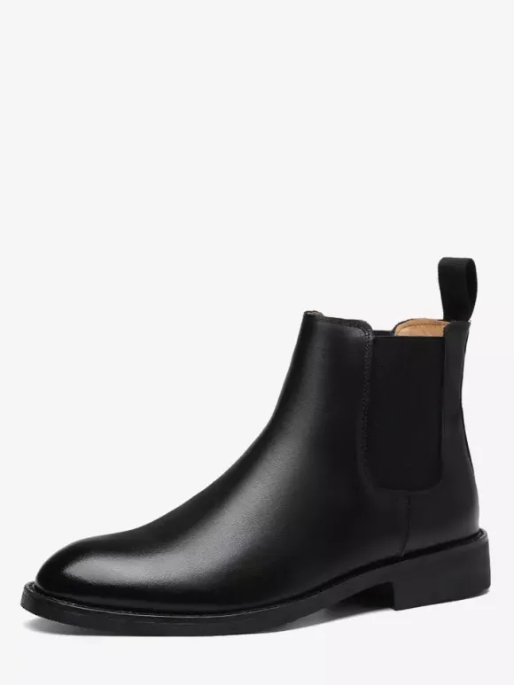 Bottines Chelsea pour homme talons bas bout pointu en cuir noir.