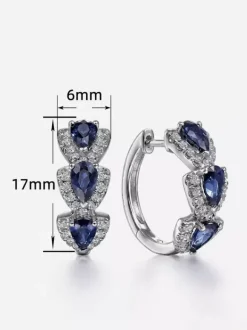 Boucles d'oreilles blanches pour adulte style western décontracté design géométrique en forme de goutte.