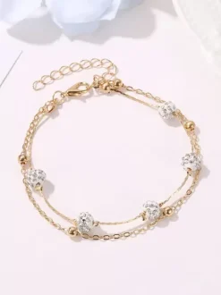 Bracelet de cheville en perles de cristal et base en métal