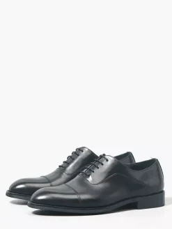 Chaussures Oxford noires à bout rapporté pour hommes en cuir véritable à lacets.