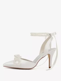 Chaussures de mariage ivoire en satin à bout pointu avec perles et n艙ud à talons hauts