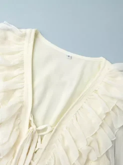 Chemise blanche à volants pour femme col en V manches longues élégantes