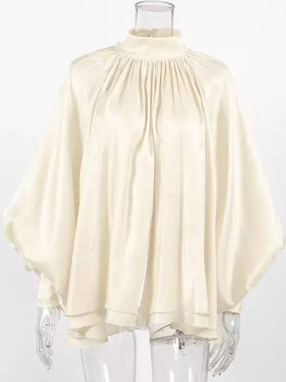 Chemisier oversize en satin crème brillant à col montant froncé manches ballon et poignets perlés