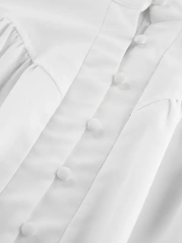 Chemisier vintage à manches bouffantes et col montant pour femme collection automne 2026