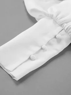 Chemisier péplum blanc élégant pour femme - Col V dos nu manches lanternes coupe ajustée - Idéal pour le printemps et le soir (2026)