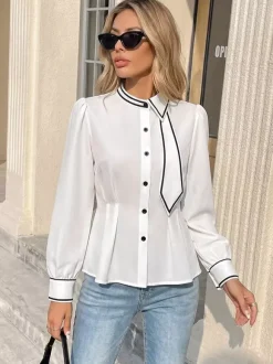 Chemisier péplum à col bordé noir col n艙ud papillon manches longues coupe ajustée