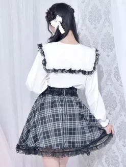 Chemisiers gothiques Lolita haut Lolita blanc à manches longues n艙uds en dentelle chemise Lolita à blocs de couleurs