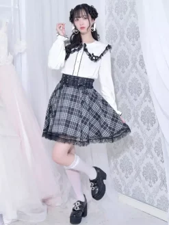 Chemisiers gothiques Lolita haut Lolita blanc à manches longues n艙uds en dentelle chemise Lolita à blocs de couleurs