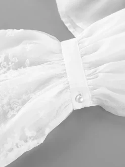 Chemisier vintage à col volanté taille élastique poignets évasés et manches longues