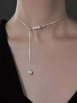 Collier ras-de-cou minimaliste en perles petit collier de devant longue perle pendante. Bijou de cou avec une seule perle.