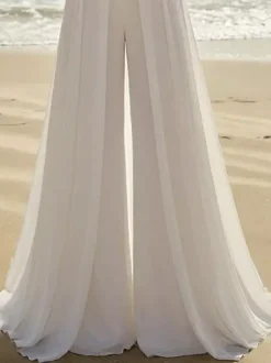 Combinaison de mariée 2 pièces en mousseline plissée avec traîne décolleté c艙ur sans manches taille naturelle couleur ivoire