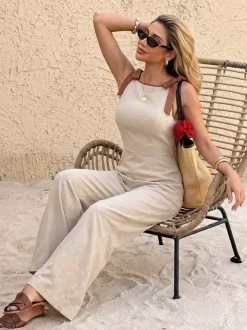 Combinaison pantalon sans manches à taille haute et jambes larges ornée de bordures chocolat contrastées et de liens aux épaules.