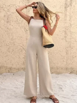 Combinaison pantalon sans manches à taille haute et jambes larges ornée de bordures chocolat contrastées et de liens aux épaules.