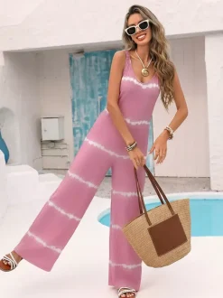 Combinaison rose pâle à imprimé tie-dye horizontal sans manches col V bretelles taille haute jambes larges idéale pour les vacances.