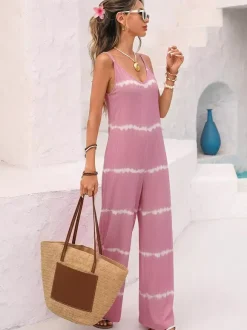 Combinaison rose pâle à imprimé tie-dye horizontal sans manches col V bretelles taille haute jambes larges idéale pour les vacances.