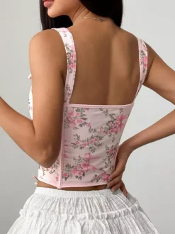 Corsets blancs chics sans manches à bretelles et décolleté ajusté avec n艙uds.