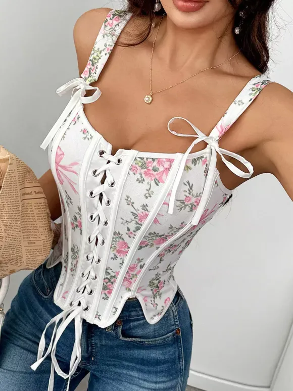 Corsets blancs chics sans manches à bretelles et décolleté ajusté avec n艙uds.