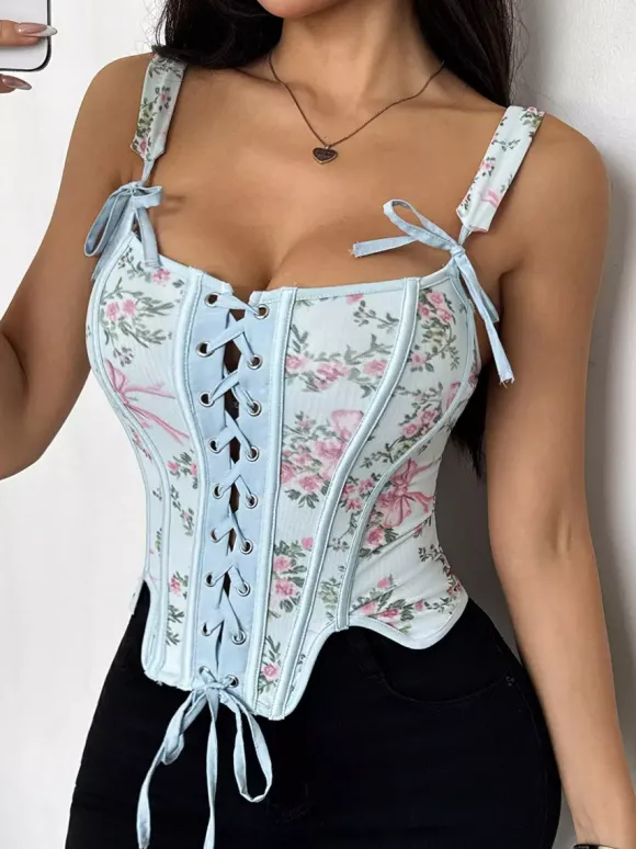 Corsets blancs chics sans manches à bretelles et décolleté ajusté avec n艙uds.
