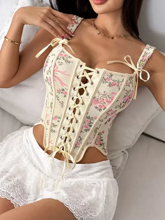 Corsets blancs chics sans manches à bretelles et décolleté ajusté avec n艙uds.