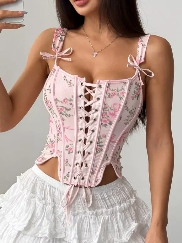 Corsets blancs chics sans manches à bretelles et décolleté ajusté avec n艙uds.