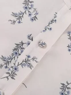 Ensemble deux pièces blanc écru imprimé chic style streetwear col rond manches bouffantes manches longues pantalon