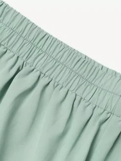 Ensemble deux pièces élégant pour femme : blazer cache-c艙ur tailleur pantalon à jambes larges et coupe ajustée idéal pour le printemps 2026.