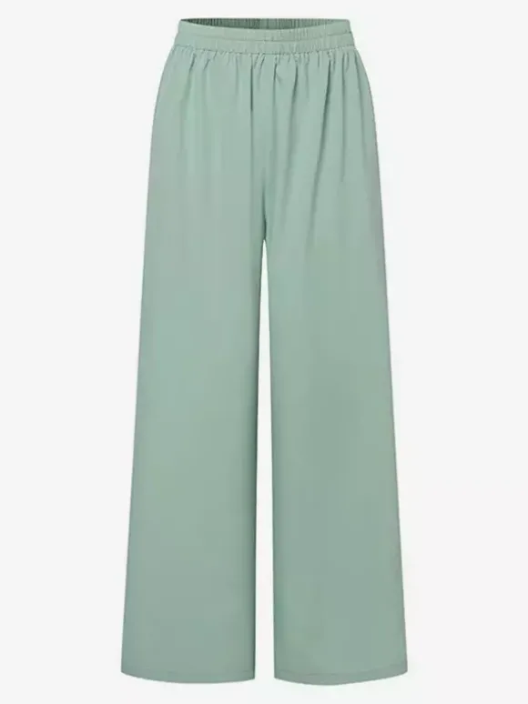 Ensemble deux pièces élégant pour femme : blazer cache-c艙ur tailleur pantalon à jambes larges et coupe ajustée idéal pour le printemps 2026.