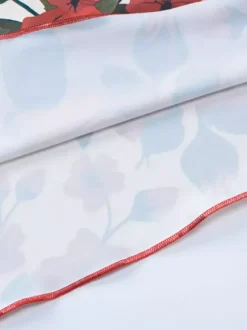 Ensemble deux pièces rouge sexy à imprimé floral tenue de villégiature en polyester à bretelles et col fleuri jupe sans manches.