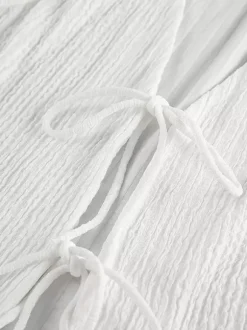 Ensemble deux pièces blanc décontracté haut sans manches à col V et pantalon élégant