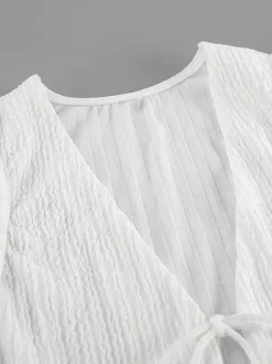 Ensemble deux pièces blanc décontracté haut sans manches à col V et pantalon élégant
