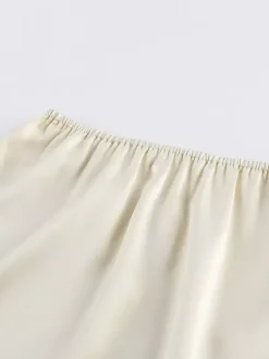 Ensemble deux pièces jupe sans manches en dentelle abricot chic pour un look décontracté au quotidien