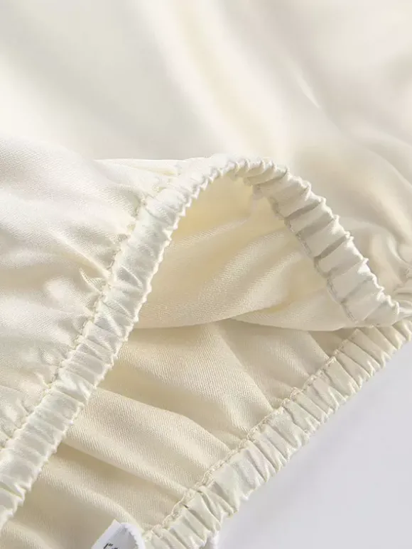 Ensemble deux pièces jupe sans manches en dentelle abricot chic pour un look décontracté au quotidien