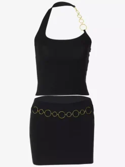 Ensemble deux pièces noir style resort avec chaînes jupe asymétrique sexy sans manches à dos nu.