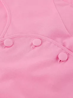 Ensemble deux pièces rose avec haut court et jupe longue taille haute pour l'été 2026