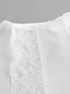 Ensemble 2 pièces pour femme 2026 : haut à col en V bordé de dentelle satinée et mini-jupe à nouer sur le devant