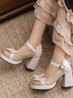 Escarpins Lolita à talons compensés en cuir verni ornés de n艙uds en dentelle rose