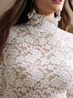 Haut à col montant en dentelle florale manches longues coupe ajustée et transparente pour femme 2026