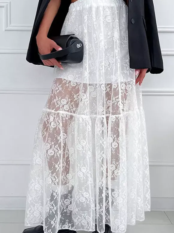Jupe longue à volants en dentelle florale transparente à taille élastique noire et blanche transparente.