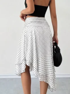 Jupe midi blanche à petits pois taille haute ourlet asymétrique à volants irréguliers en mousseline fluide.