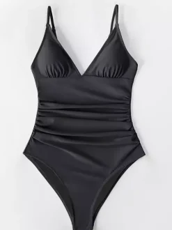 Maillot de bain une pièce femme à col en V froncé et bretelles spaghetti effet ventre plat.