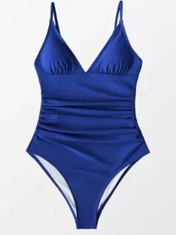 Maillot de bain une pièce femme à col en V froncé et bretelles spaghetti effet ventre plat.