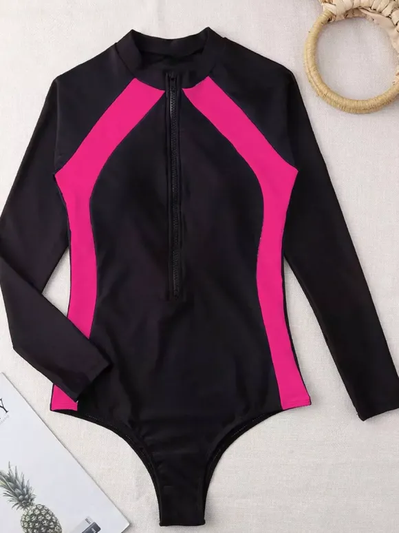 Maillot de bain une pièce anti-UV à manches longues et empiècements contrastés fermeture éclair sur le devant.
